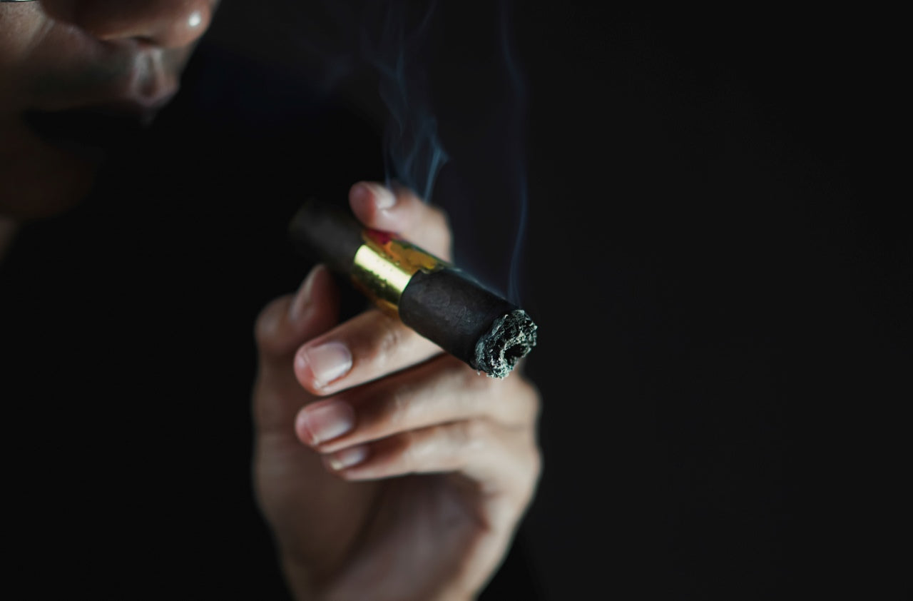 why is cigarette called a fag This artist creates drawings on rolling papers., In the UK, the word ‘fag’ is a colloquial term for a cigarette, but it is also used as a homophobic slur. This play on words inspired British artist