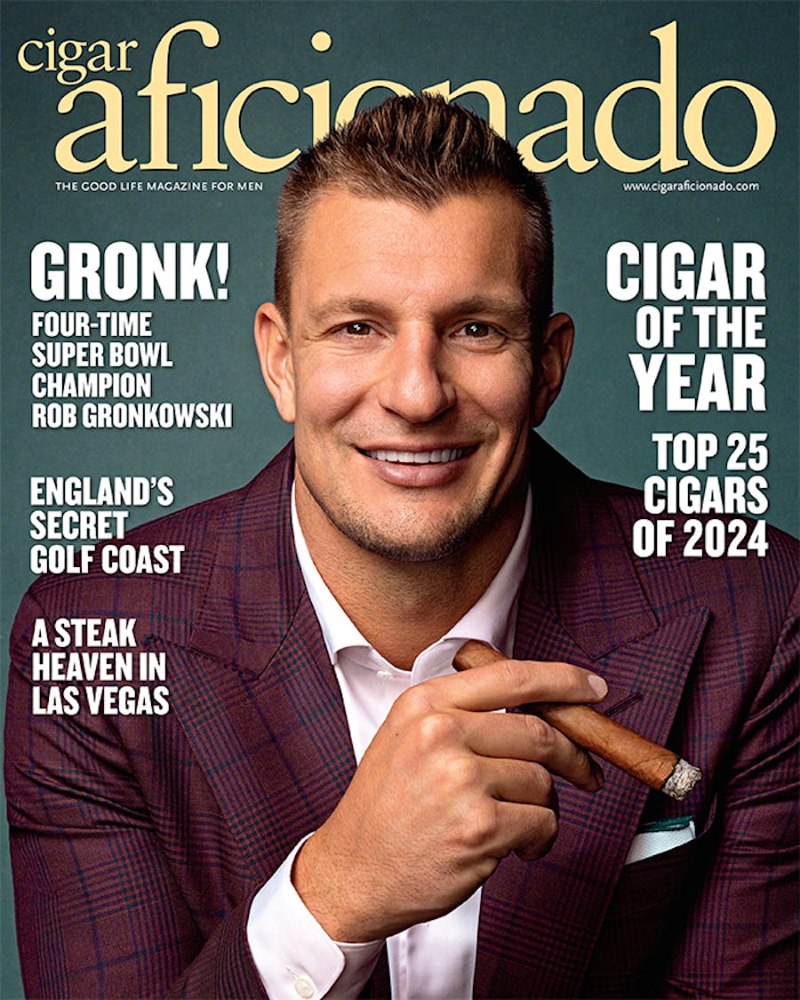 Magazine cover featuring a man holding a cigar with text about Rob Gronkowski and top cigars of 2024.